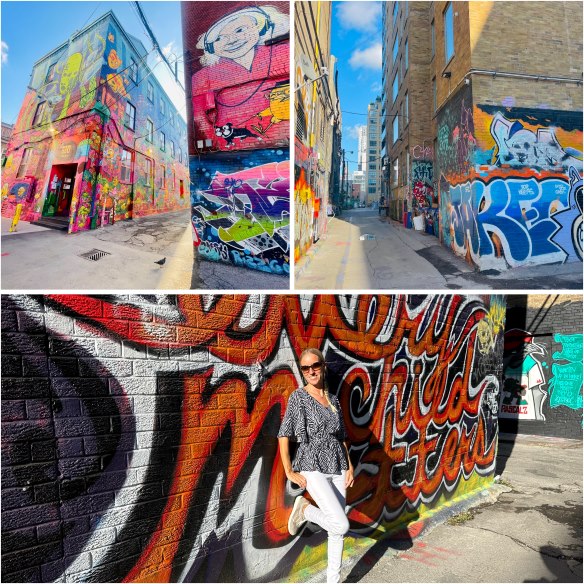 Graffity Alley Toronto, bunte besprühte Wände, Frau lehnt sich an Wand
