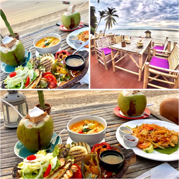 Cabana, voller Tisch mit Essen wie Thai Food, Antipasti und Kokosnuss 